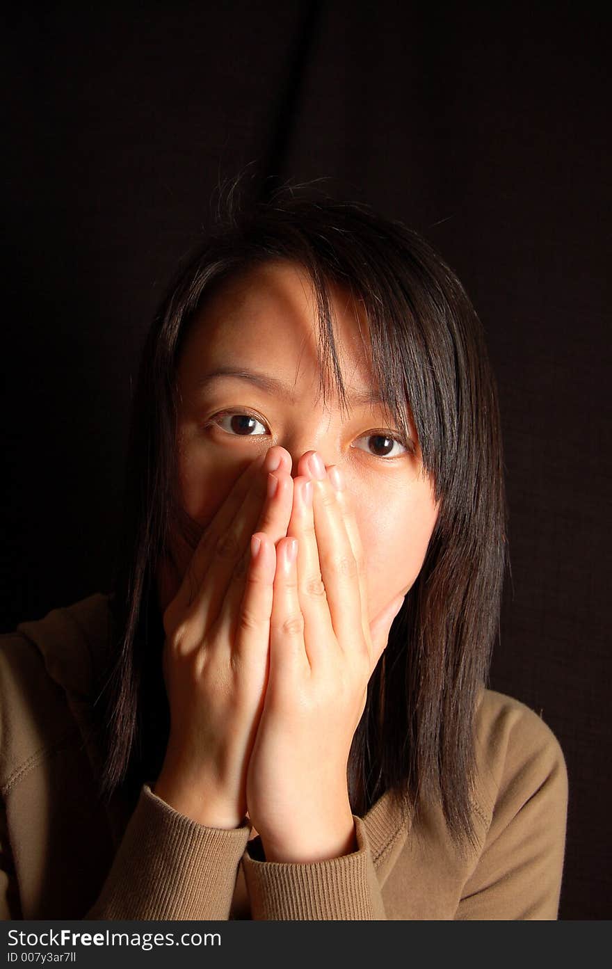 An asian chinese lady showing nervous expression