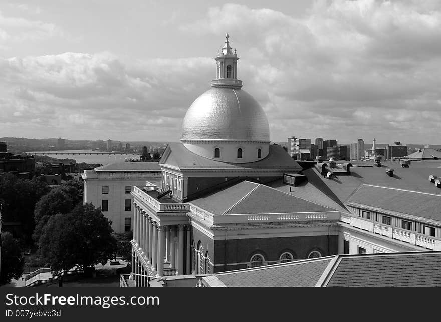 Showing Beacon street and the Massachusetts State House on a cloudy day. Showing Beacon street and the Massachusetts State House on a cloudy day