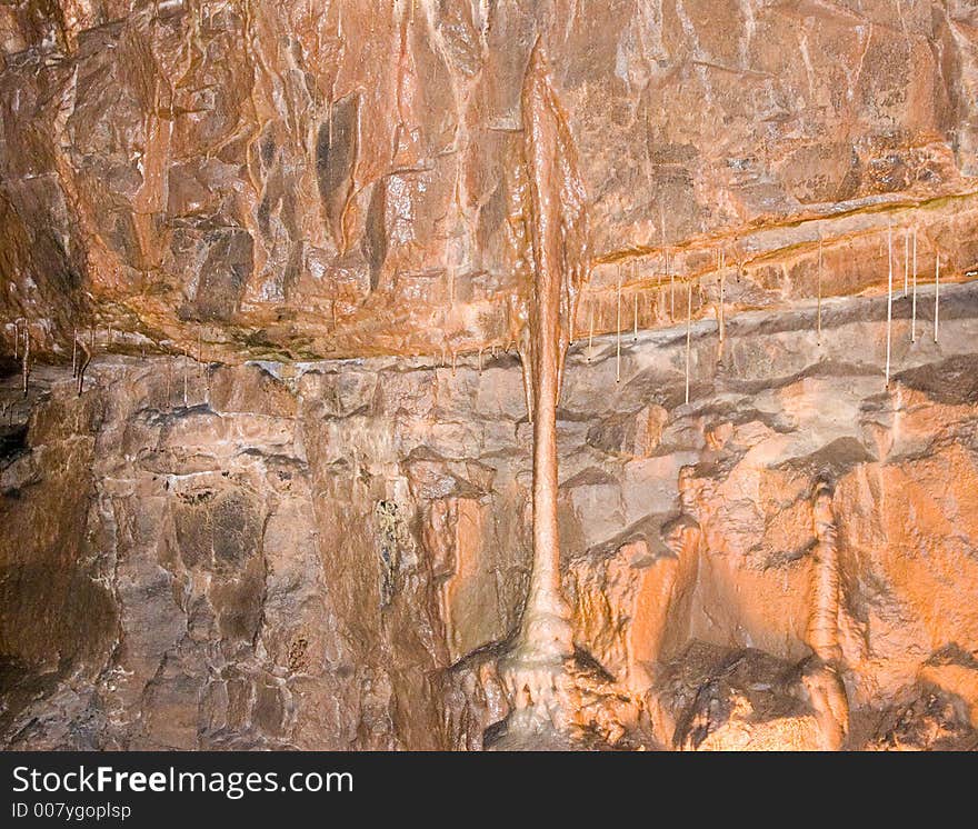 Stalamite and Stalctite on cave wall.