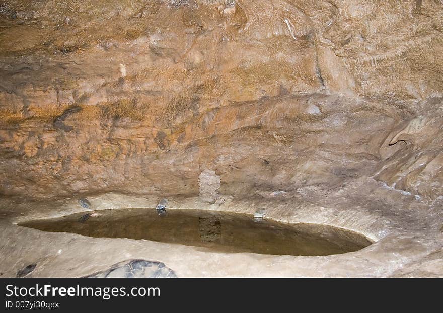 Pool in the floor of a cave. Pool in the floor of a cave.