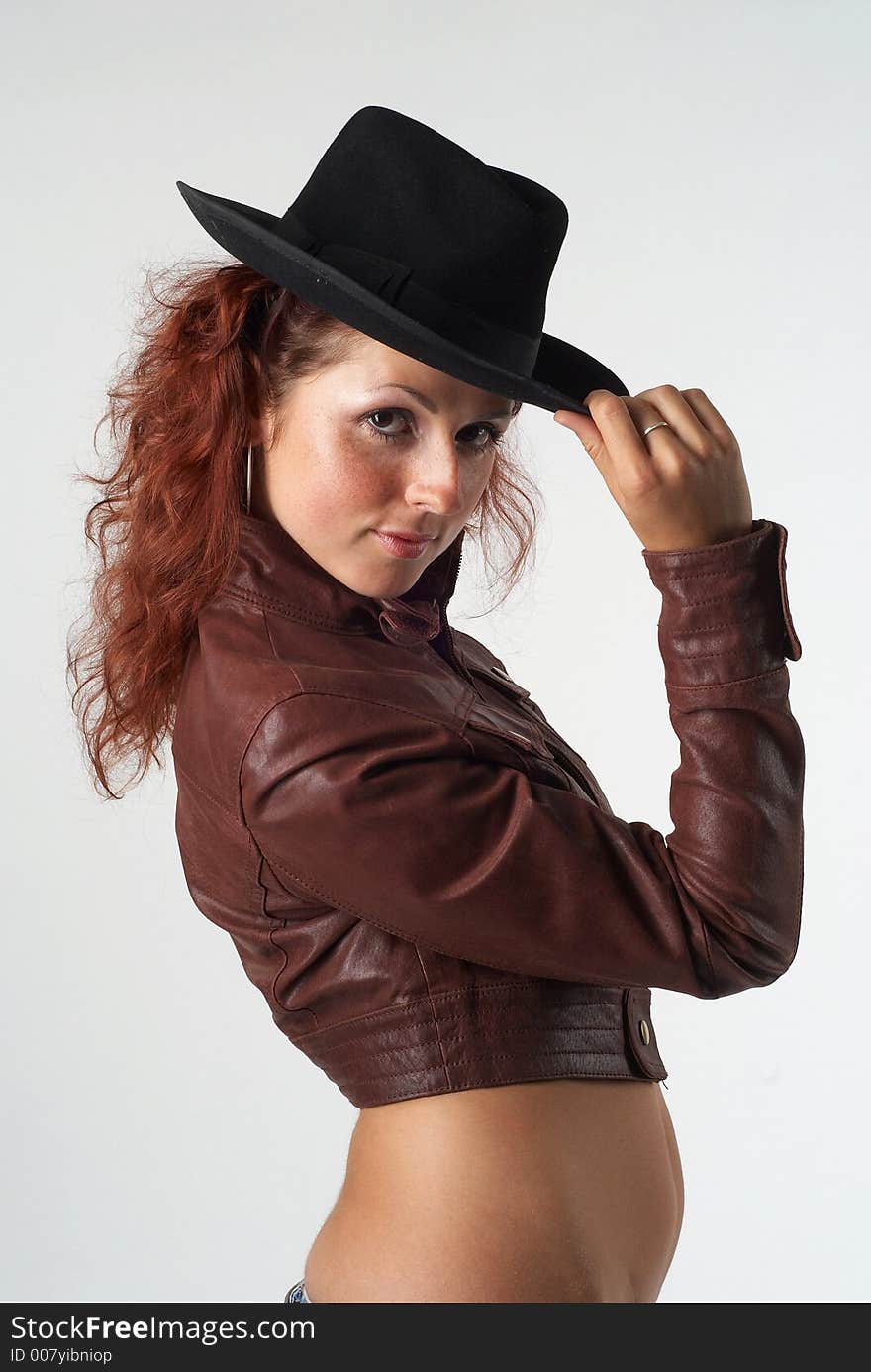 Young redhead girl with hat