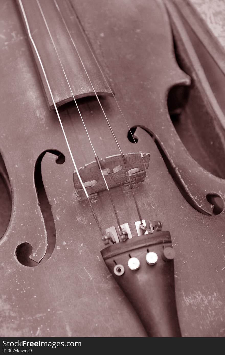 Old dirty violin in closeup