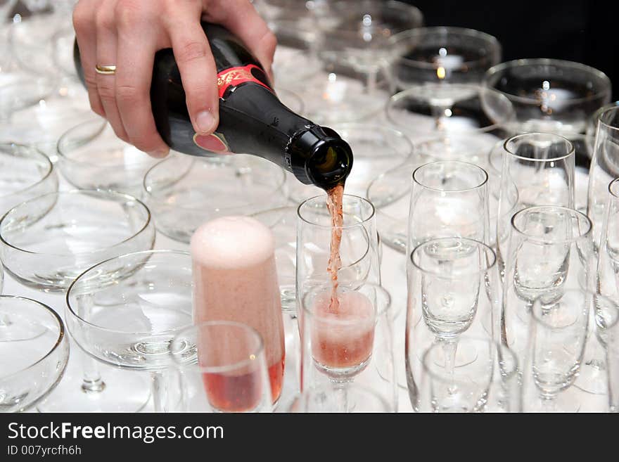 Pouring red wine in cup in restaurant