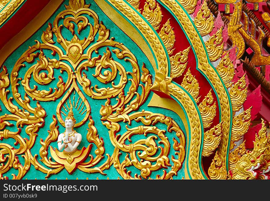 Buddhist temple details with layers of roofs at wat in Surat thani