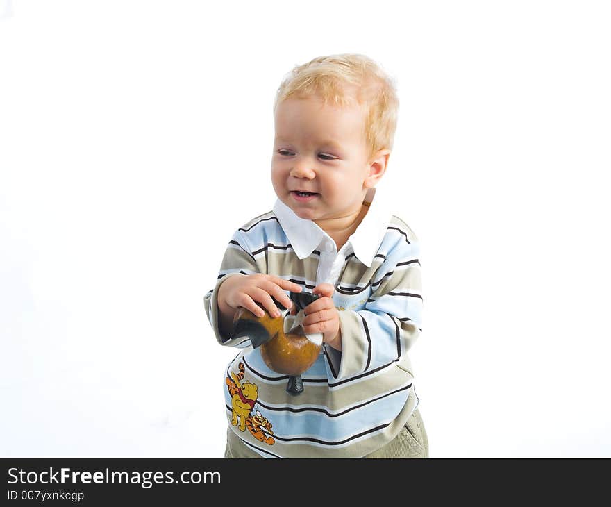 Little boy with toy. Studio shot. Little boy with toy. Studio shot.