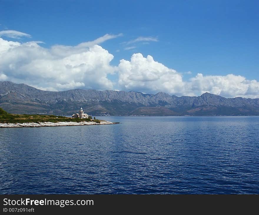 Lighthouse in blue adriatic sea