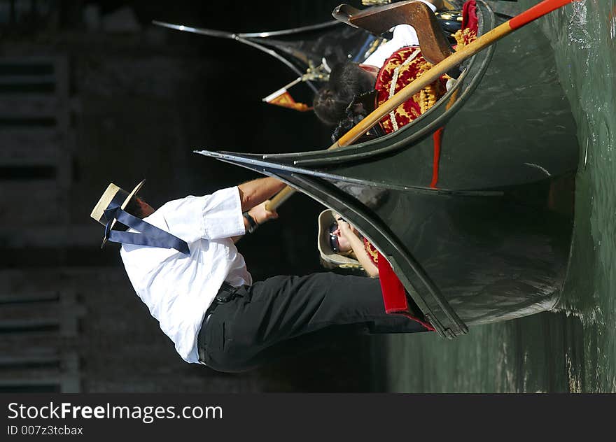 Part of the make-up of Venice are the Gondolas and the Gondaliers. The Gondalier here is talking to his passenger. Part of the make-up of Venice are the Gondolas and the Gondaliers. The Gondalier here is talking to his passenger.