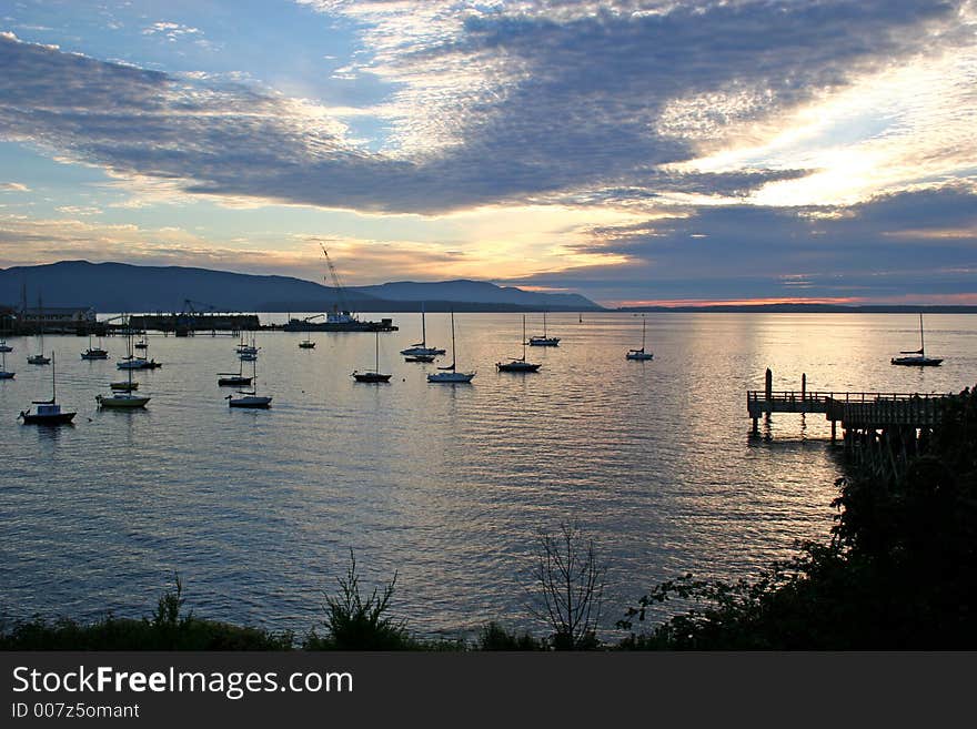 Sunset on bay with ships anchored. Sunset on bay with ships anchored