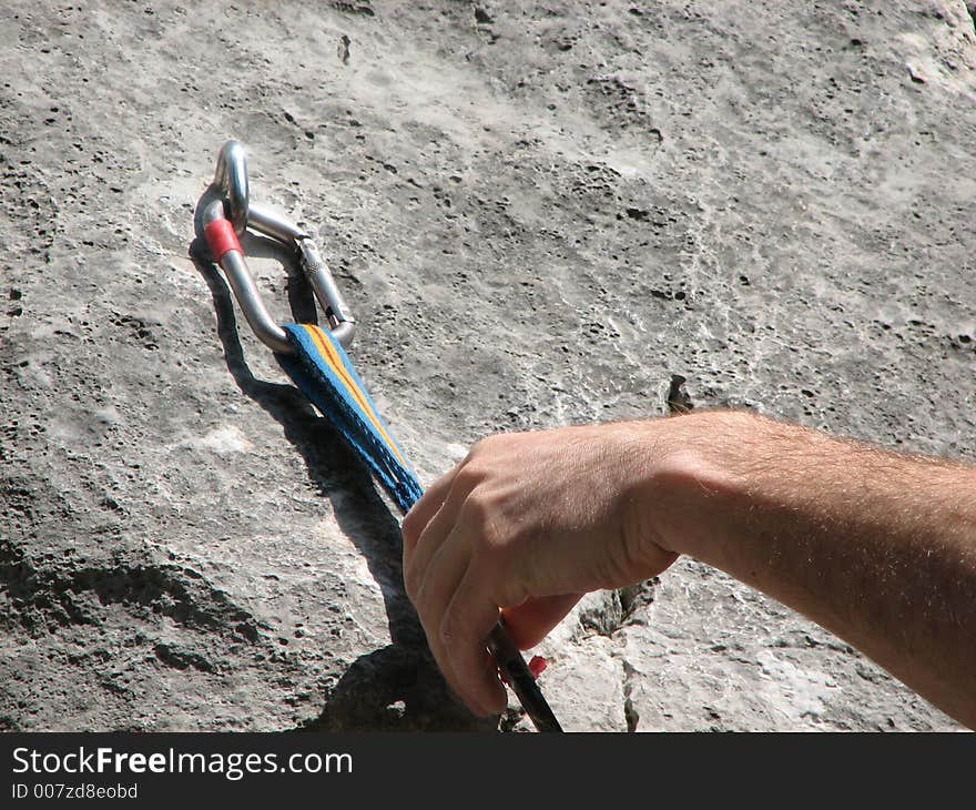 Rock climbing - clicking of the carabine for safe climbing.