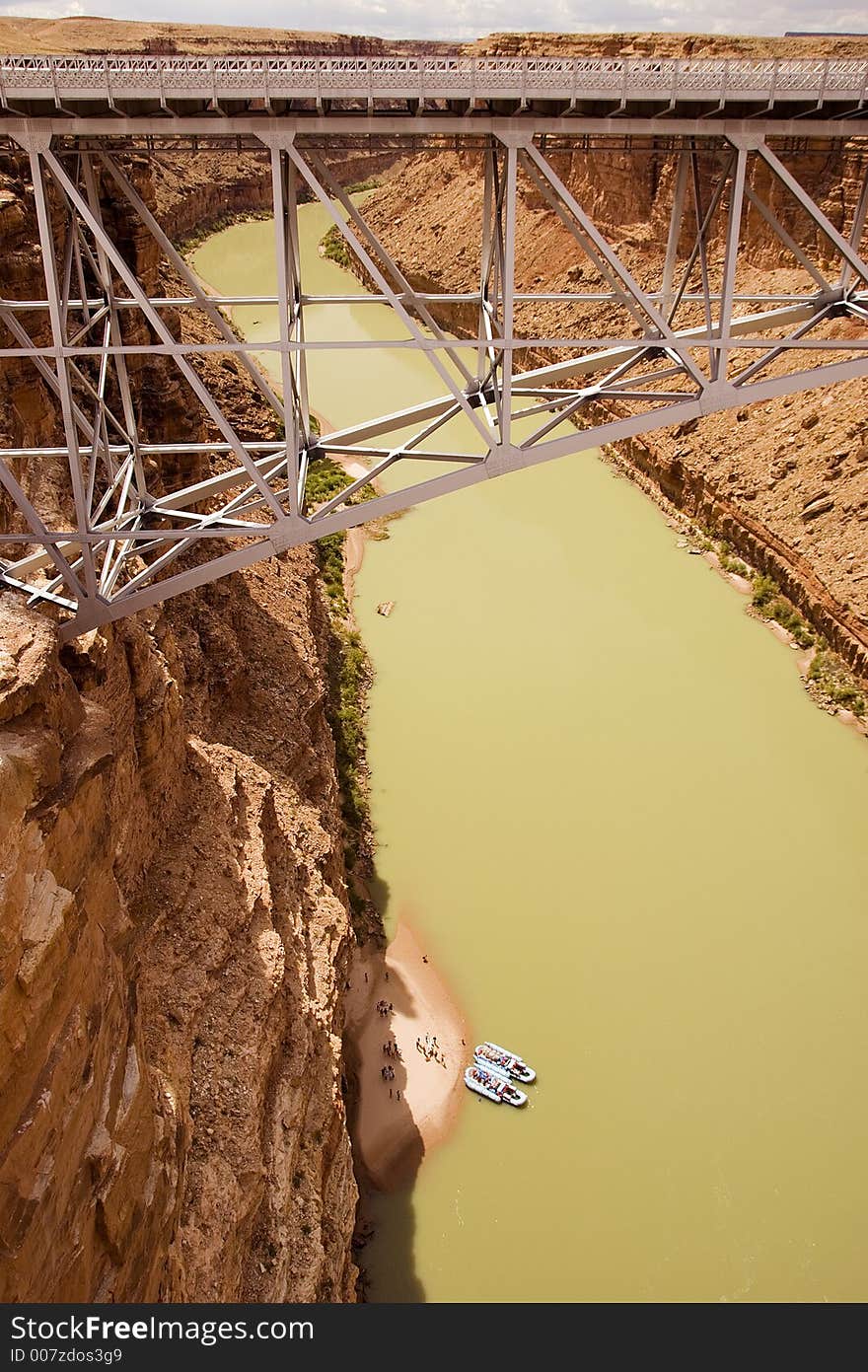 Raft trip on the Colorado River takes a lunch break under the Navajo Bridge