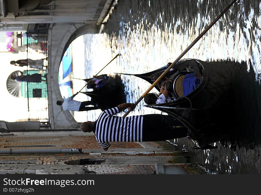 Part of the make-up of Venice are the Gondolas and the Gondaliers. With some canals being dark, they can make great silhouettes. Part of the make-up of Venice are the Gondolas and the Gondaliers. With some canals being dark, they can make great silhouettes.