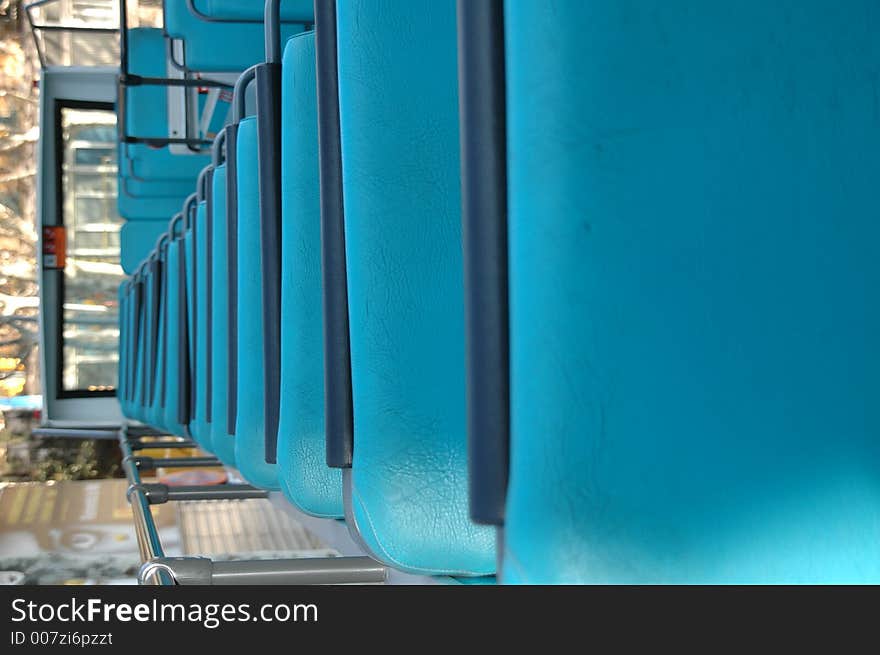 Empty blue seats on the upper deck of a bus. Empty blue seats on the upper deck of a bus