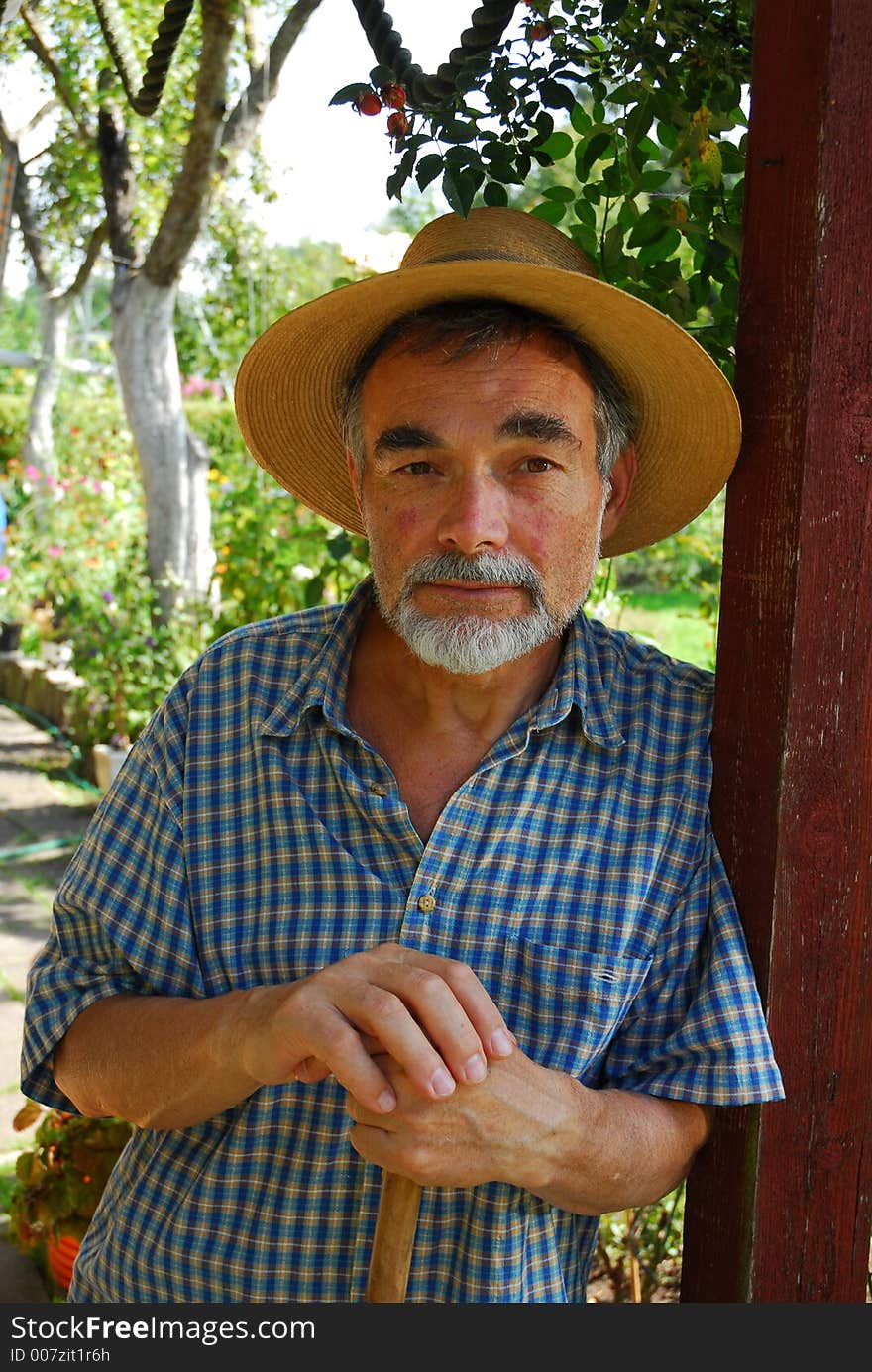 Bearded senior in straw hat