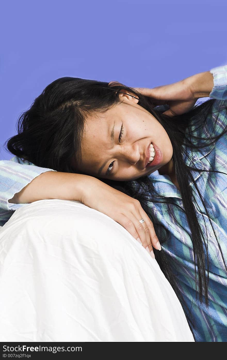 Woman with headache over blue background