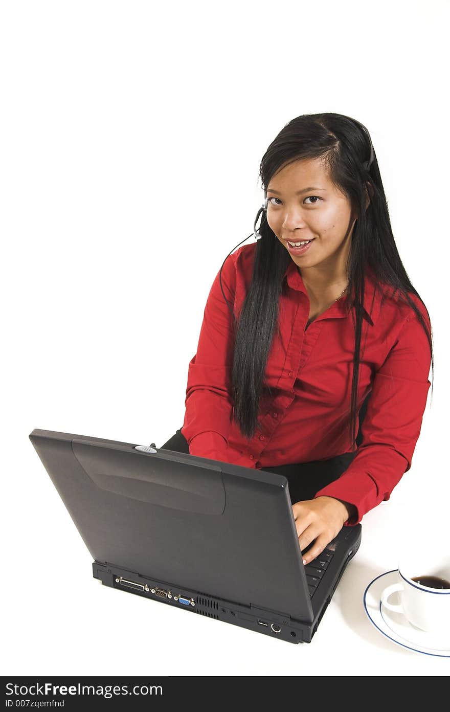 Receptionist smiling with laptop over white