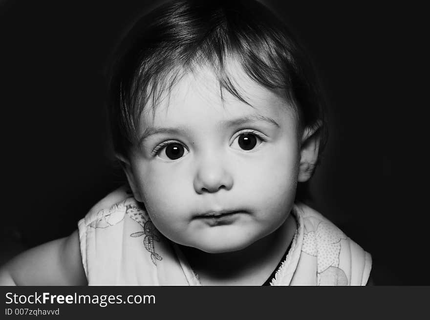 Baby portrait over black background