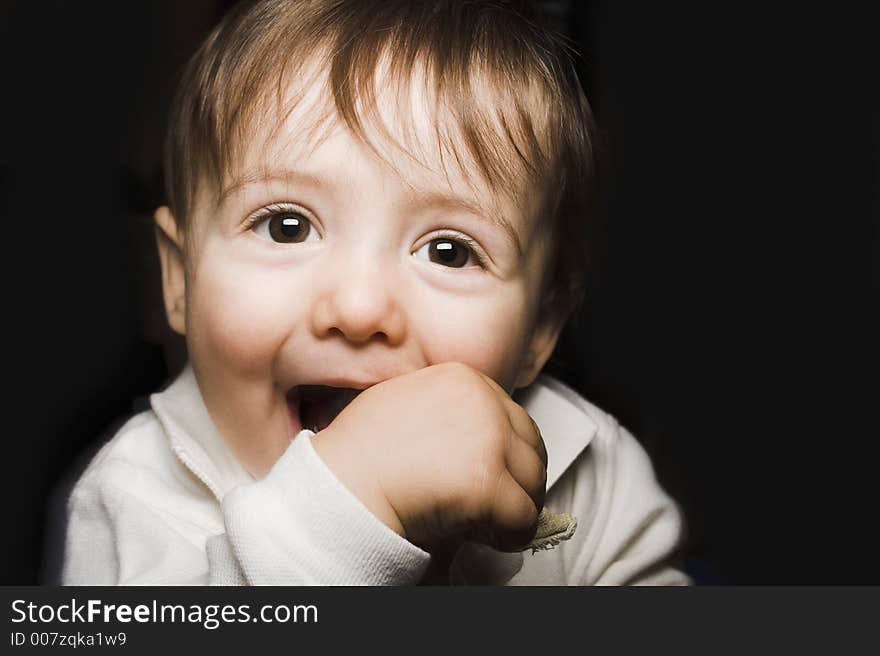 Baby portrait over black background