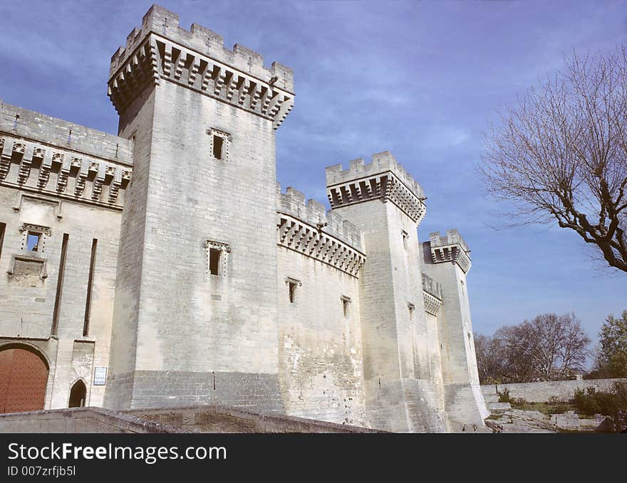 Castle of tarascon, france, showing battlements with ramparts, big square towers and machicolations. Castle of tarascon, france, showing battlements with ramparts, big square towers and machicolations