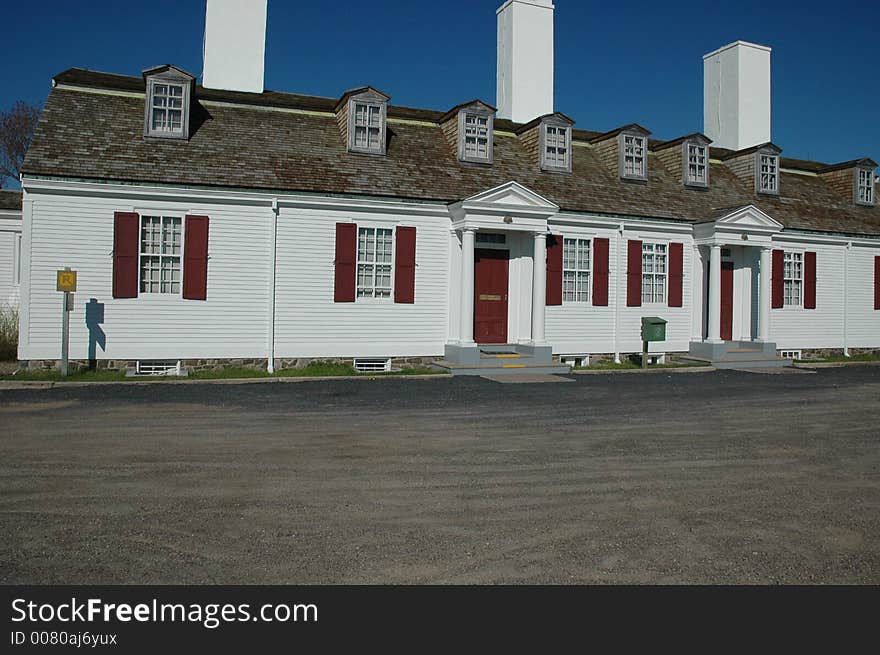 Three chimneys rise above the dormers of the Officers' Quarters at Fort Anne, a fort built in 1635 in Annapolis Royal, Nova Scotia, Canada. . Three chimneys rise above the dormers of the Officers' Quarters at Fort Anne, a fort built in 1635 in Annapolis Royal, Nova Scotia, Canada.