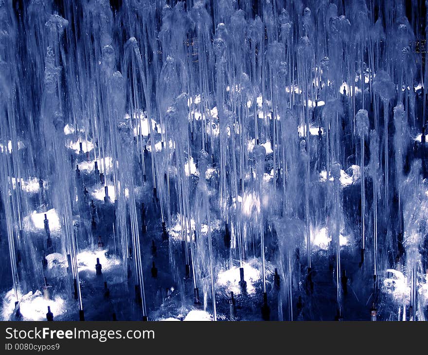 Detail on the fountain at night in blue light