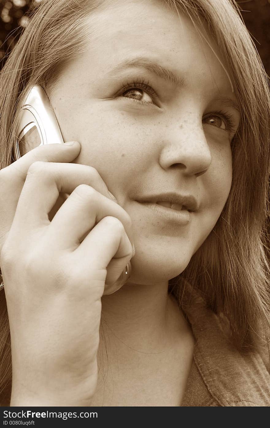 Teenage girl using cellphone outdoors