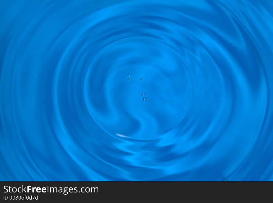 Drops of water above rippled water. Drops of water above rippled water