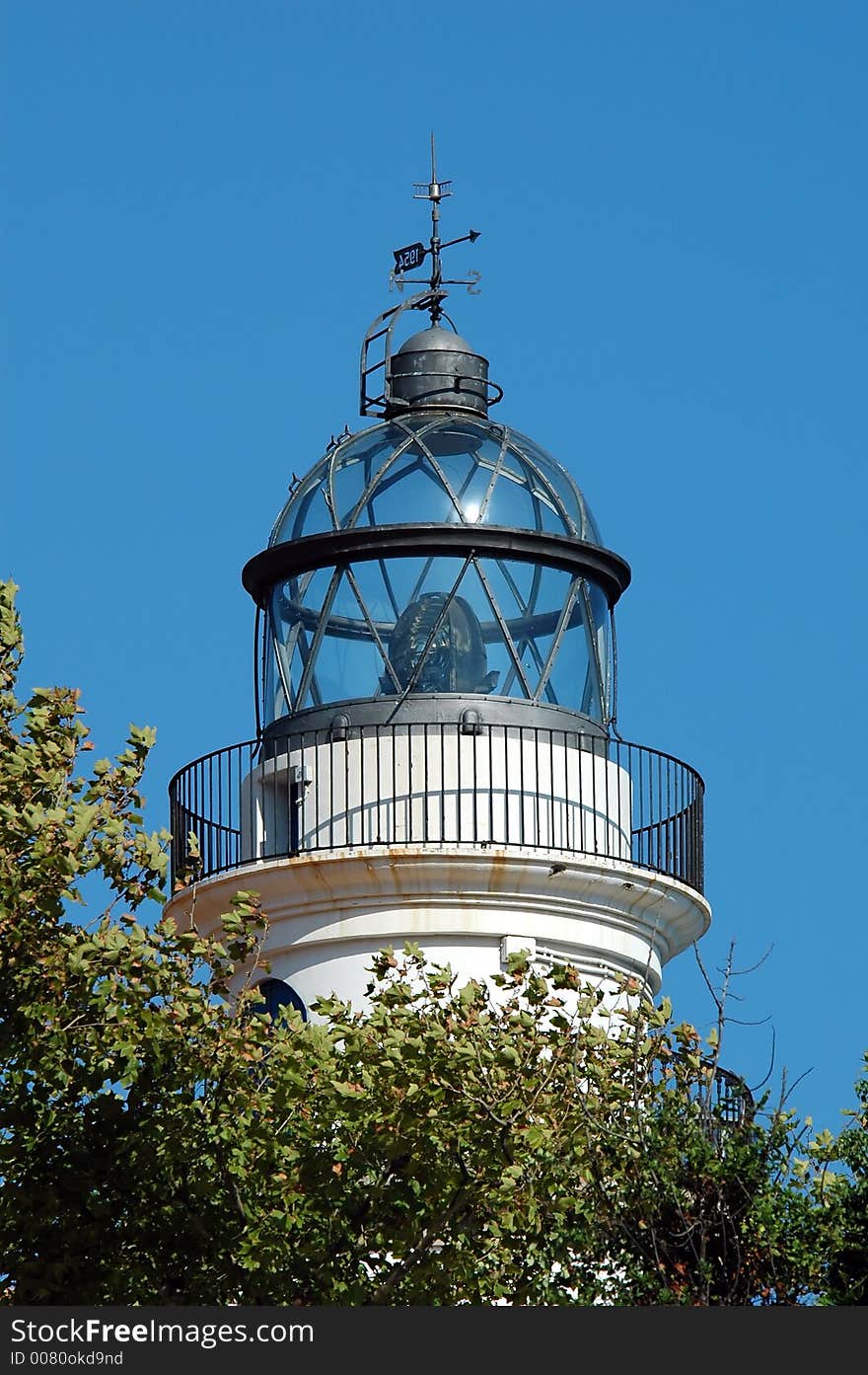 White spanish lighthouse against blue sky. White spanish lighthouse against blue sky