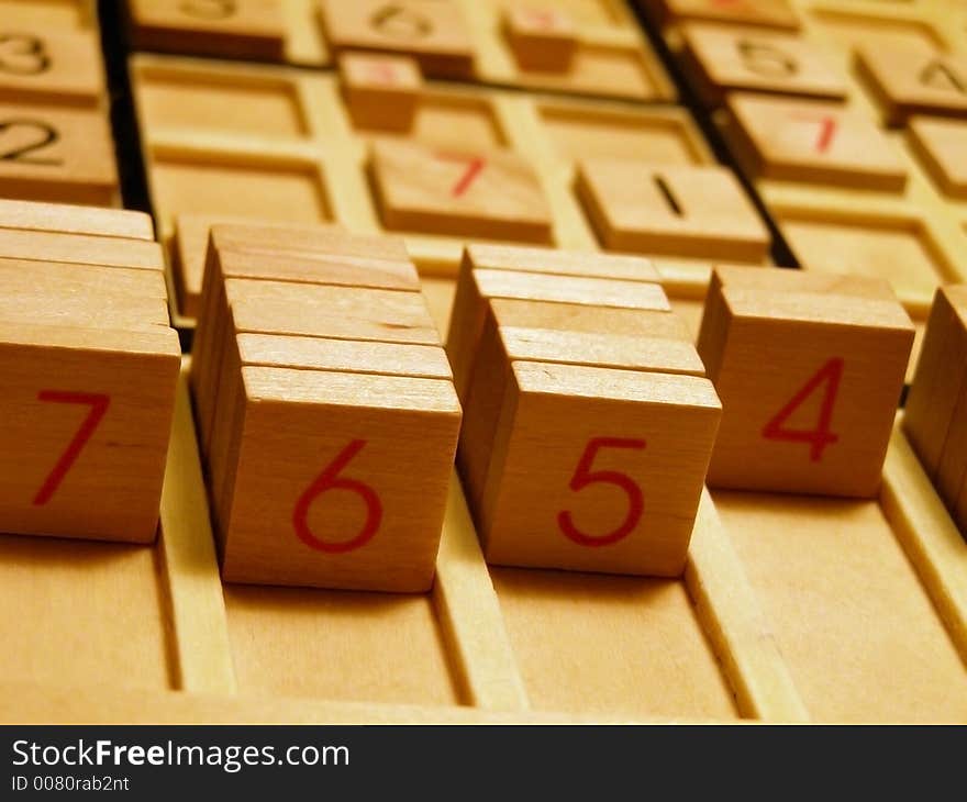 Wood sudoku board and tiles.