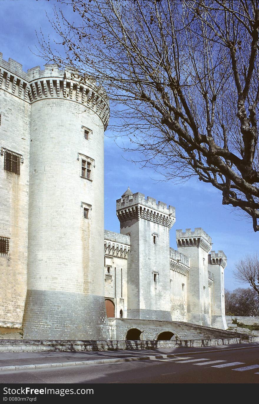 Castle of tarascon, france, showing battlements with ramparts, big round and square towers and machicolations. Castle of tarascon, france, showing battlements with ramparts, big round and square towers and machicolations