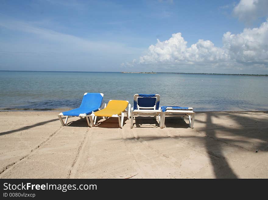 One seat not matching on tropical beach