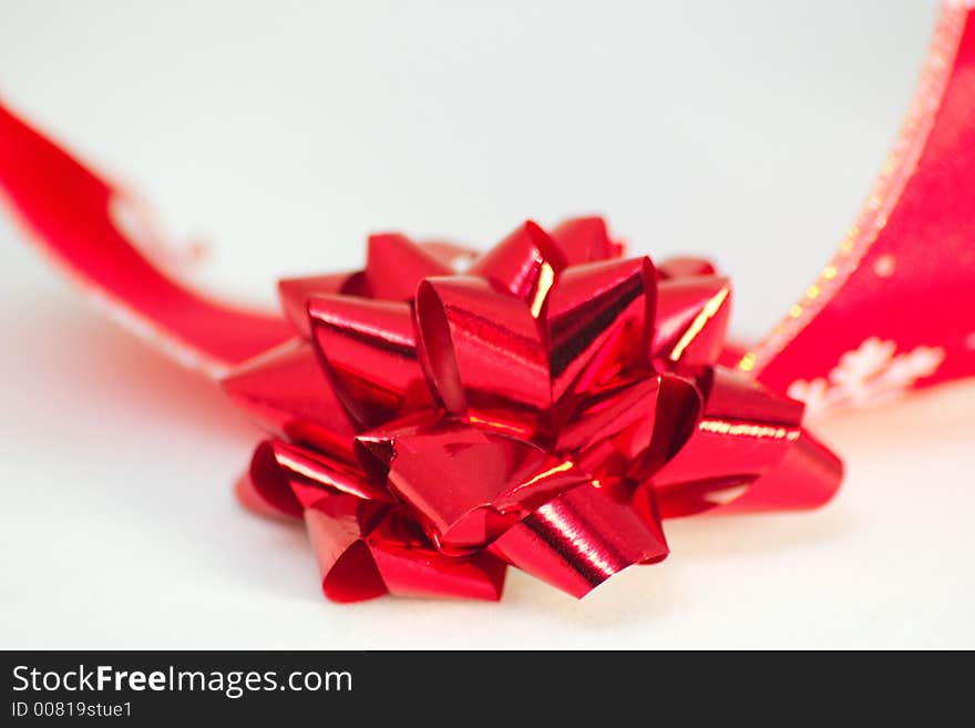 Red christmas ribbon with a bow. Red christmas ribbon with a bow