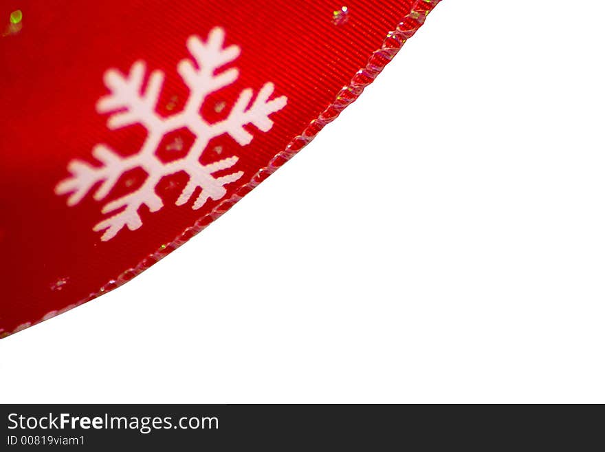 Red christmas ribbon closeup of a snowflake shallow depth of field. Red christmas ribbon closeup of a snowflake shallow depth of field