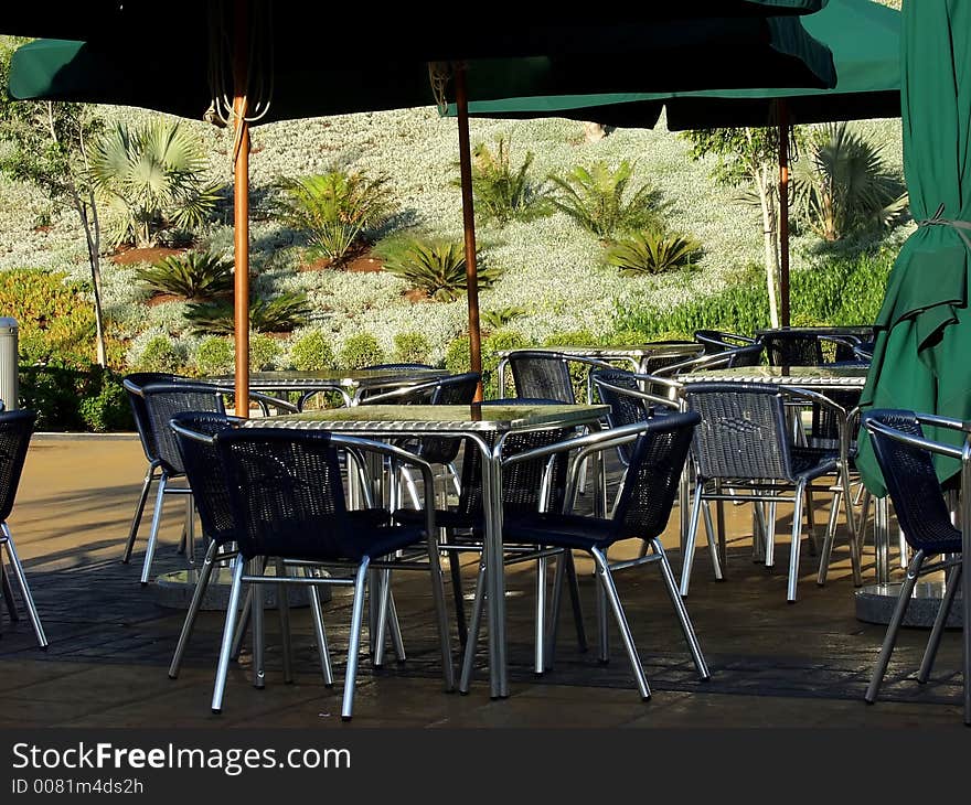 Empty restaurant outdoor terrace tables waiting for new customers