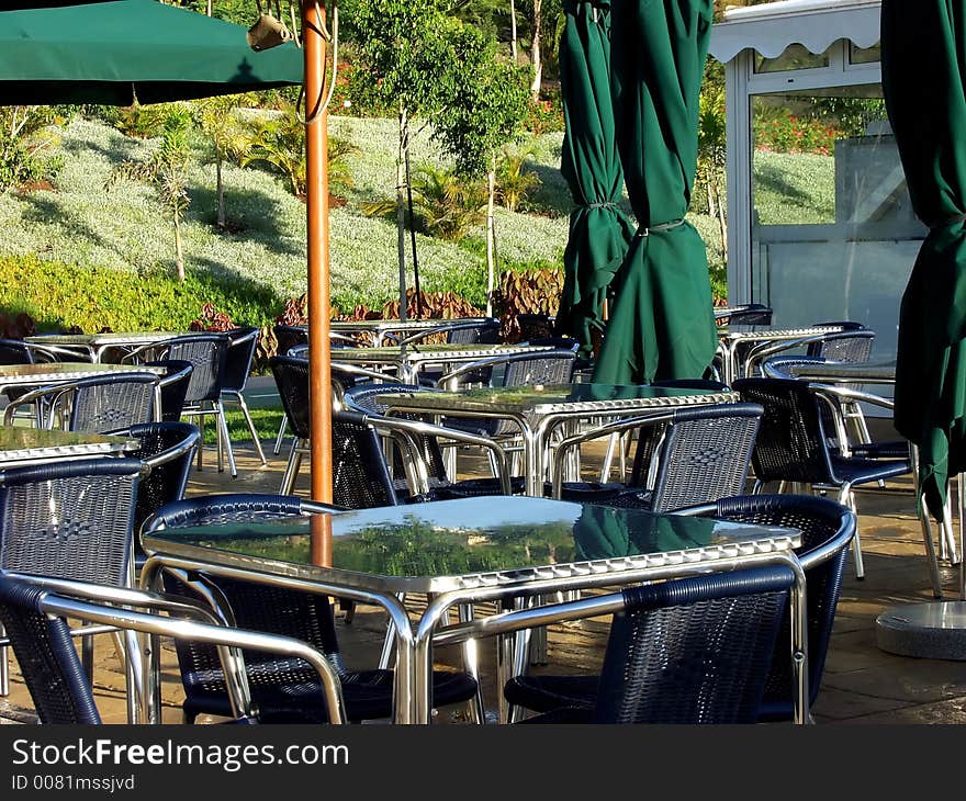 Empty restaurant outdoor terrace tables waiting for new customers