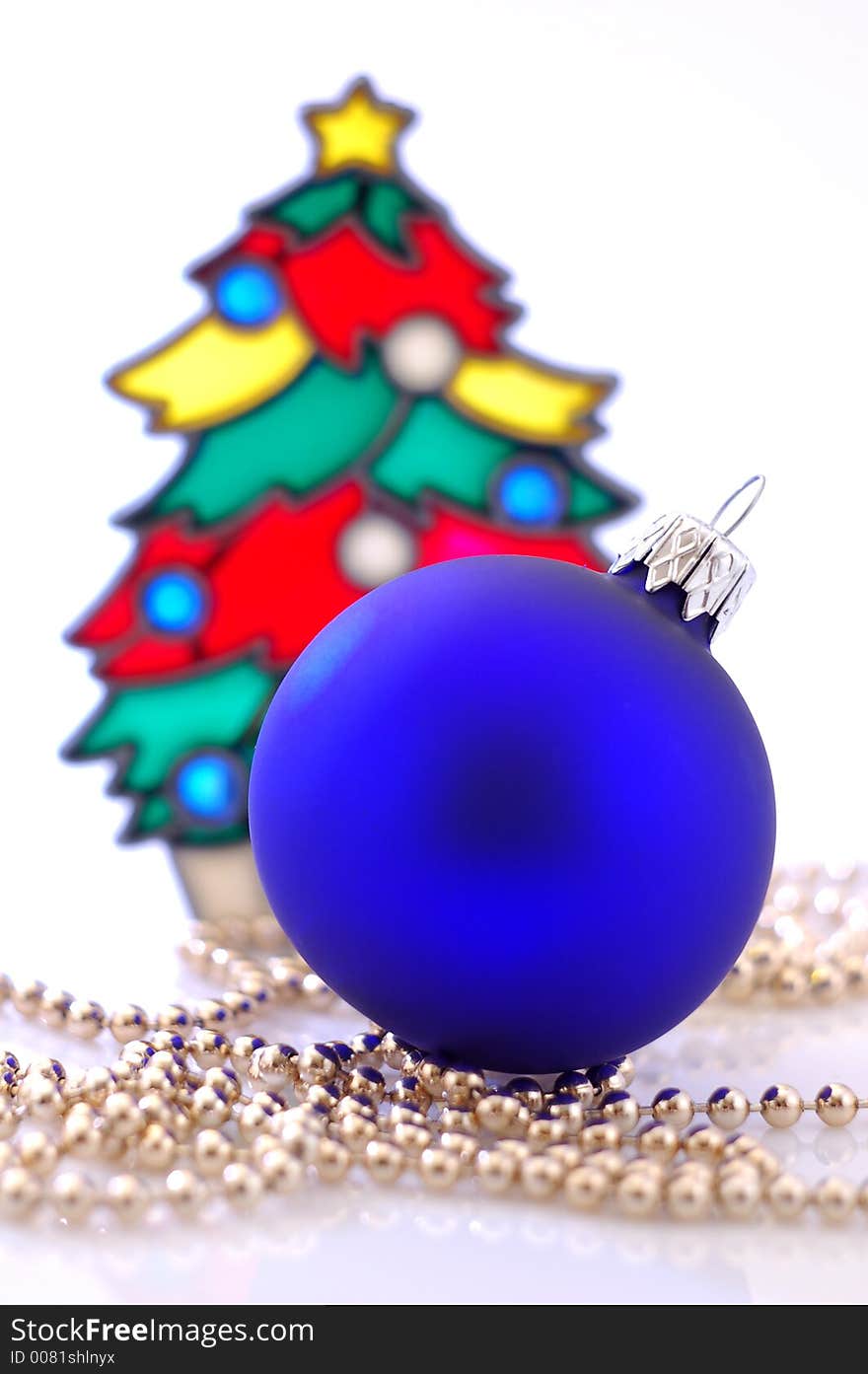 A glass ball and a christmas tree