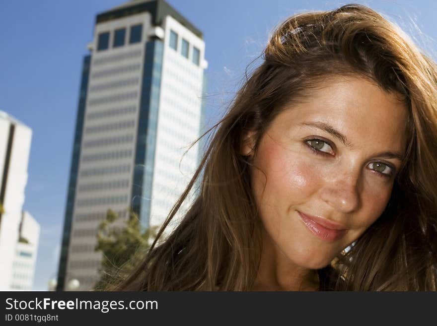 Young businesswoman in front of a building. Young businesswoman in front of a building