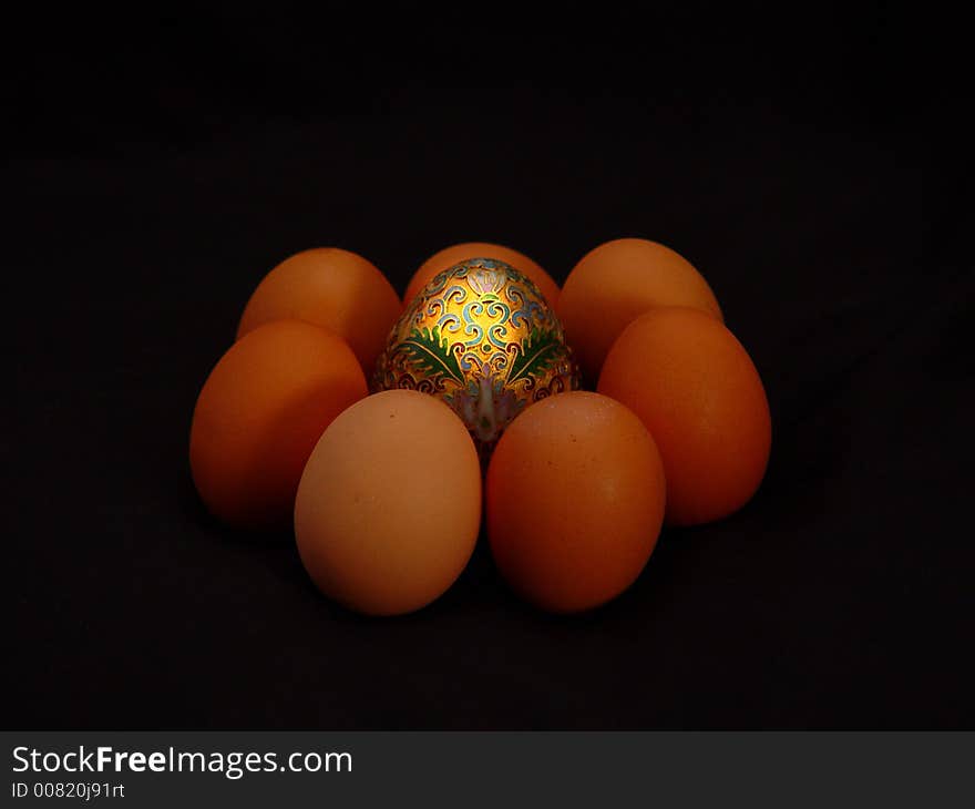 Golden egg with half dozen organic eggs. Golden egg with half dozen organic eggs.