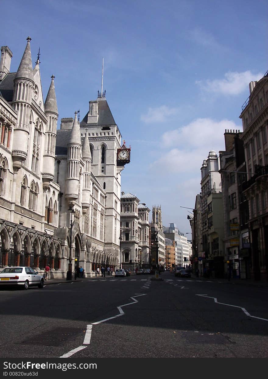 A photograph of the side of the royal courts of justice based in central London if you look you can see a clock in the image. A photograph of the side of the royal courts of justice based in central London if you look you can see a clock in the image.