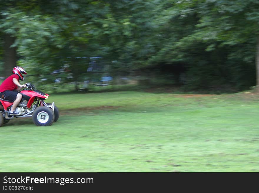 A shot of someone riding an ATV, motion blur. A shot of someone riding an ATV, motion blur