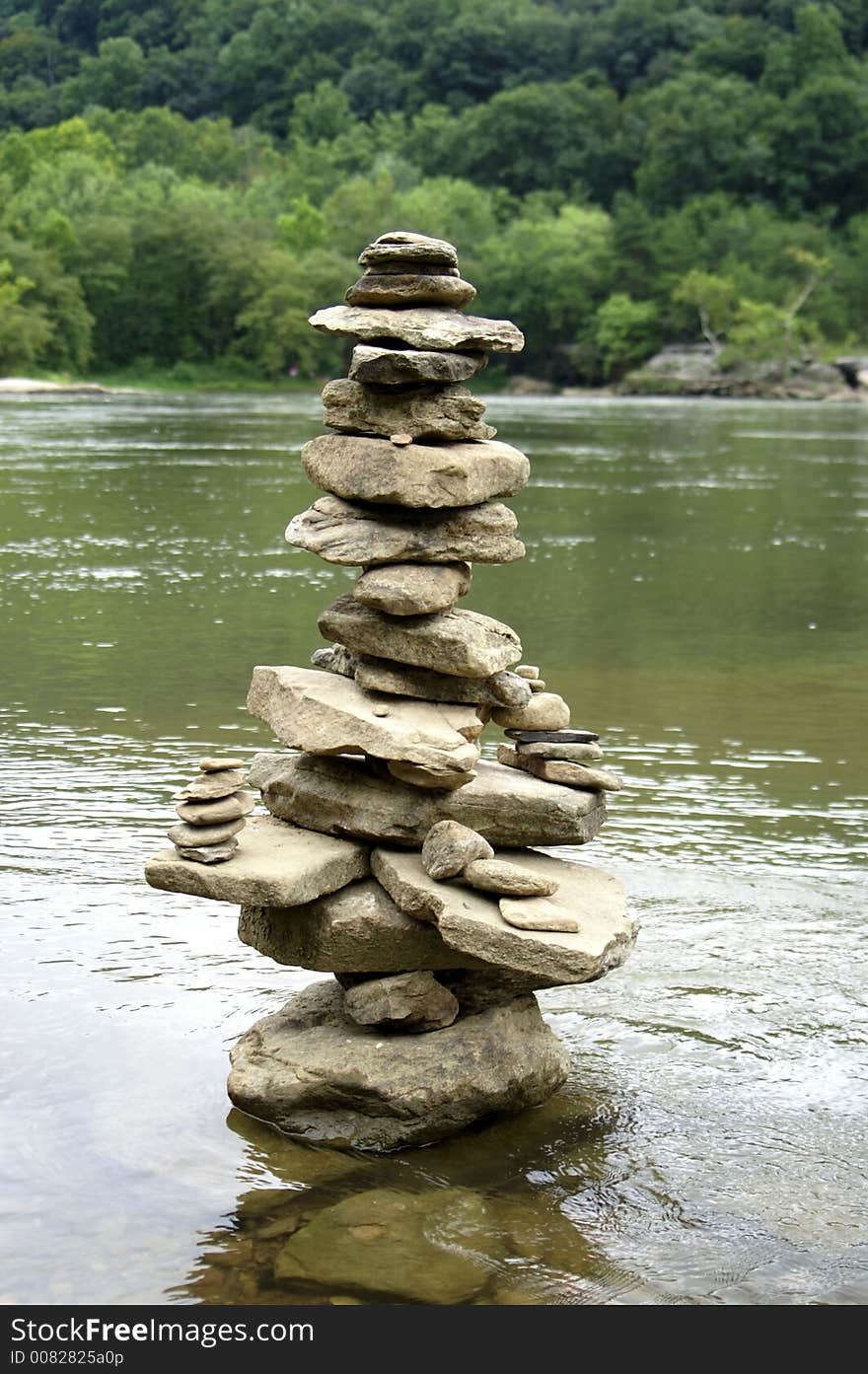 A stack of rocks in a river. A stack of rocks in a river