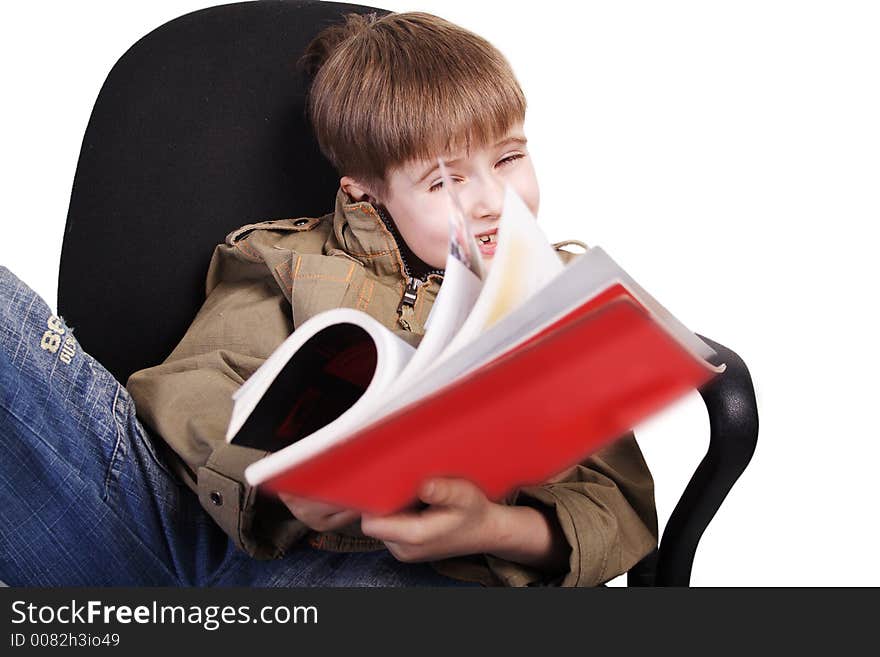 Reading fun boy. Shot in studio. Isolated with clipping path. Reading fun boy. Shot in studio. Isolated with clipping path.