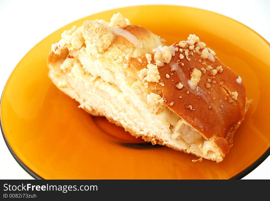 Cake on yellow plate - isolated. Cake on yellow plate - isolated