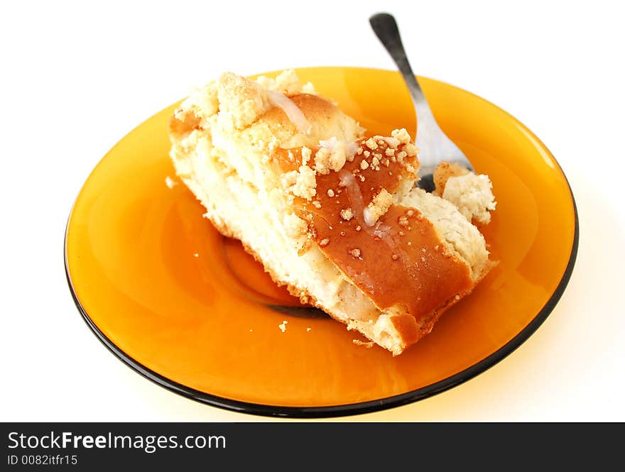 Cake on yellow plate - isolated. Cake on yellow plate - isolated