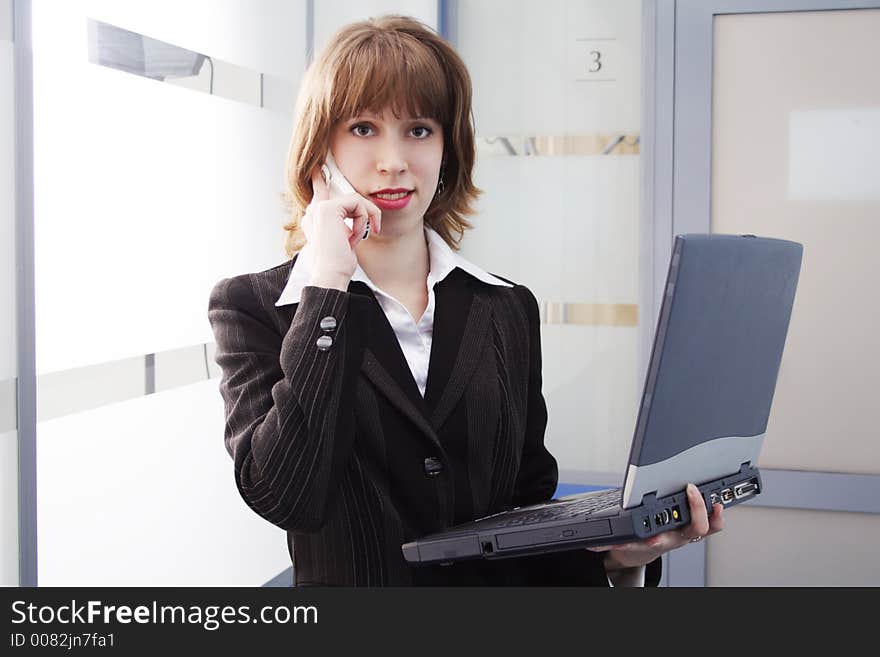 Portrait of a businesswoman when working. Shot in office. Portrait of a businesswoman when working. Shot in office.