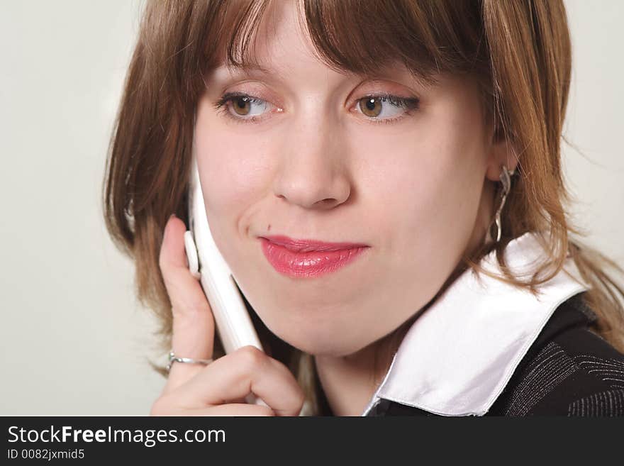 Portrait of a businesswoman calling by phone. Shot in office. Portrait of a businesswoman calling by phone. Shot in office.