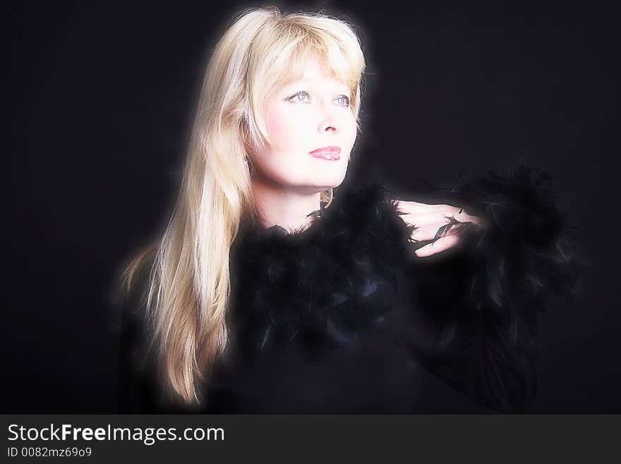 Theatrical portrait of a styled sorrow actress. Shot in studio. Theatrical portrait of a styled sorrow actress. Shot in studio.