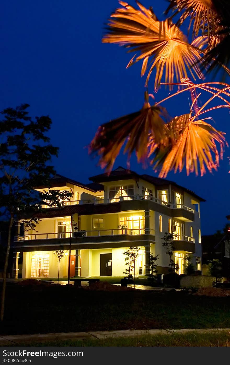 Evening scene, house and lamp pole with dark blue sky. Evening scene, house and lamp pole with dark blue sky.