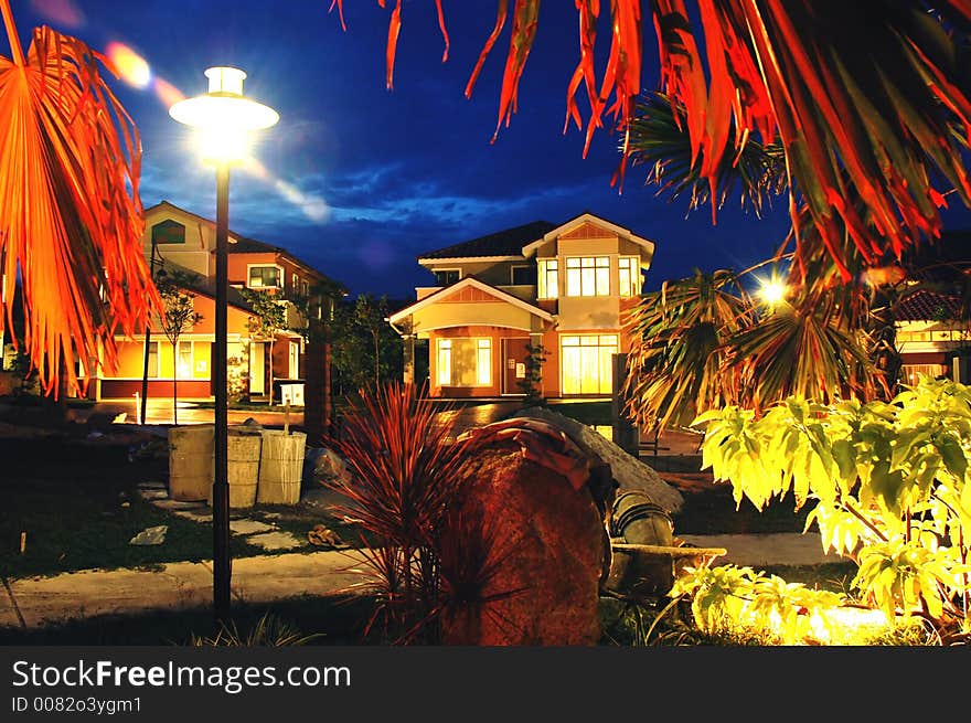 Evening scene, house and tree with dark blue sky. Evening scene, house and tree with dark blue sky.