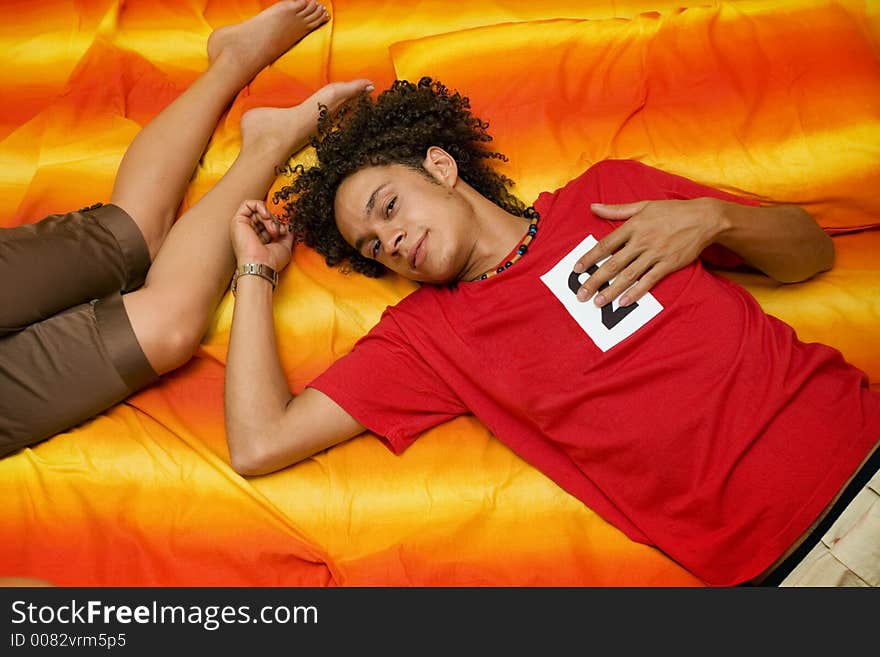 Young couple laying on the bed. Young couple laying on the bed