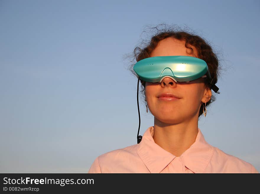 Woman with massage glasses on sky